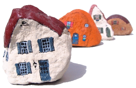 Four rocks painted as houses